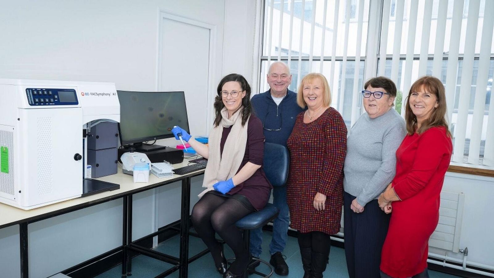 Dr. Cathriona Foley with representatives of Aid Cancer Treatment and the new Flow Cytometry equipment